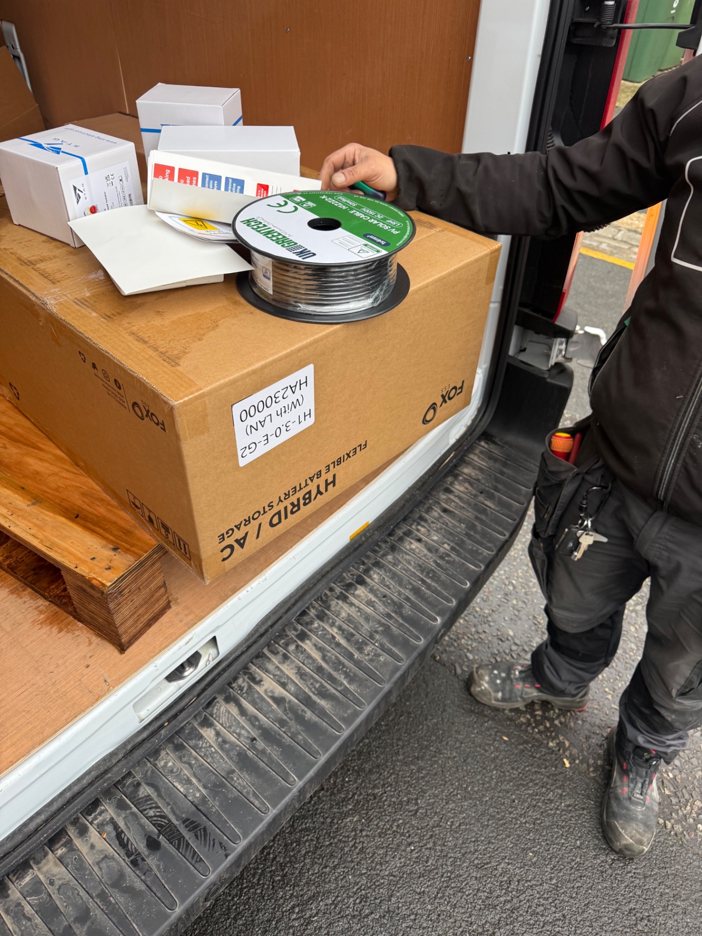 Delivery driver handling solar equipment