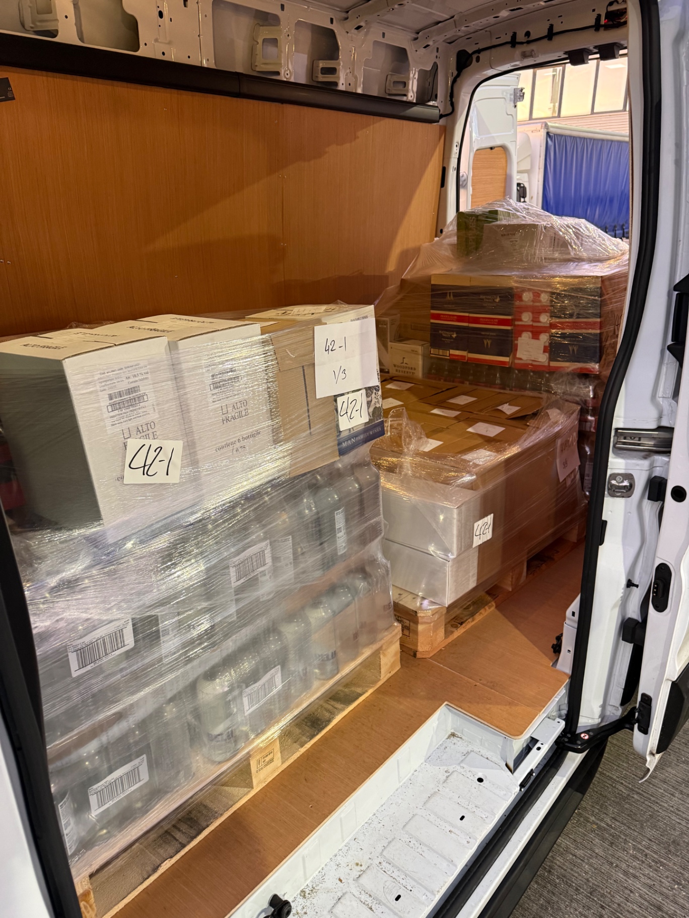 Loaded van with wine and retail pallets