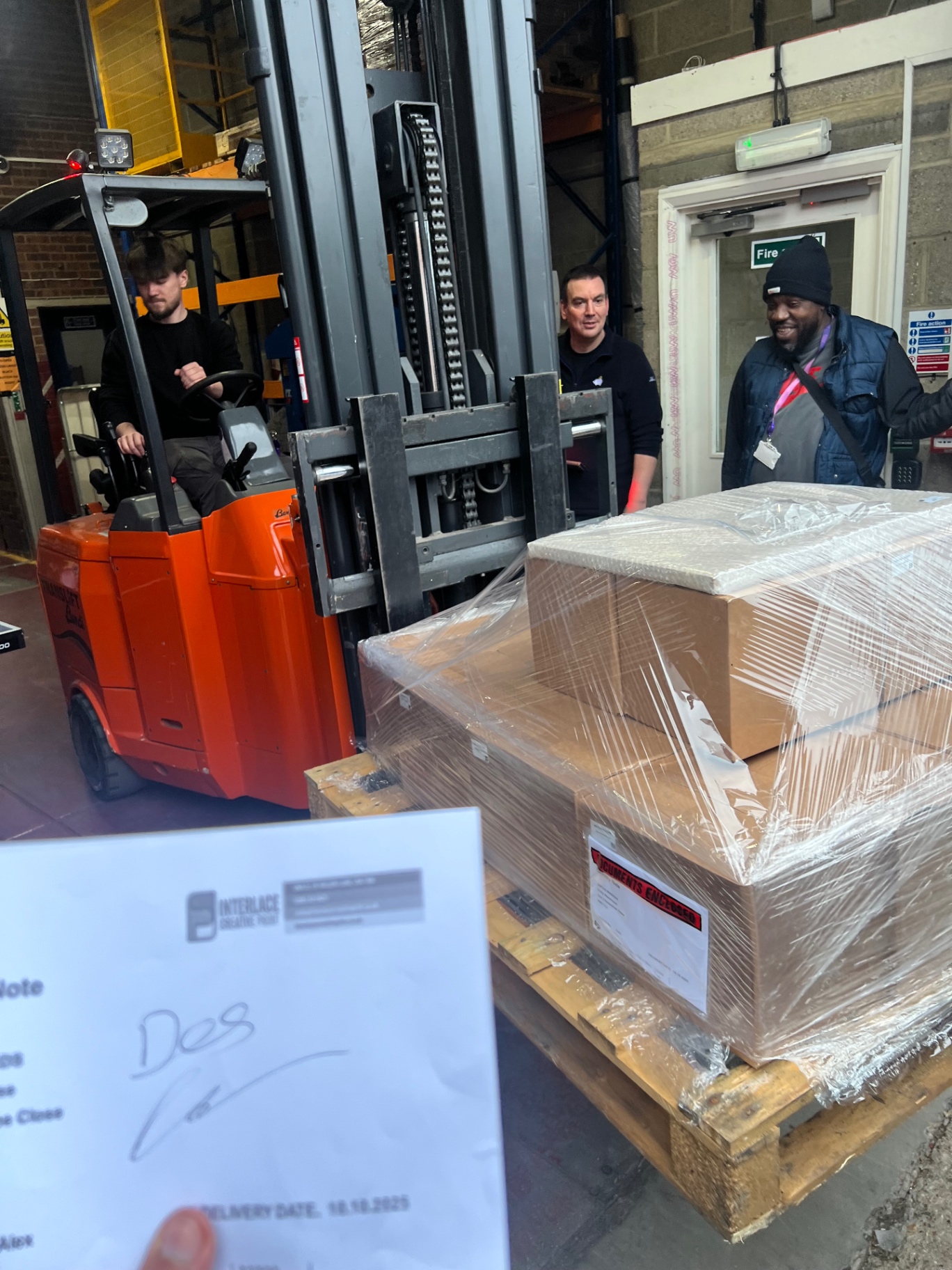 Forklift loading pallet at warehouse