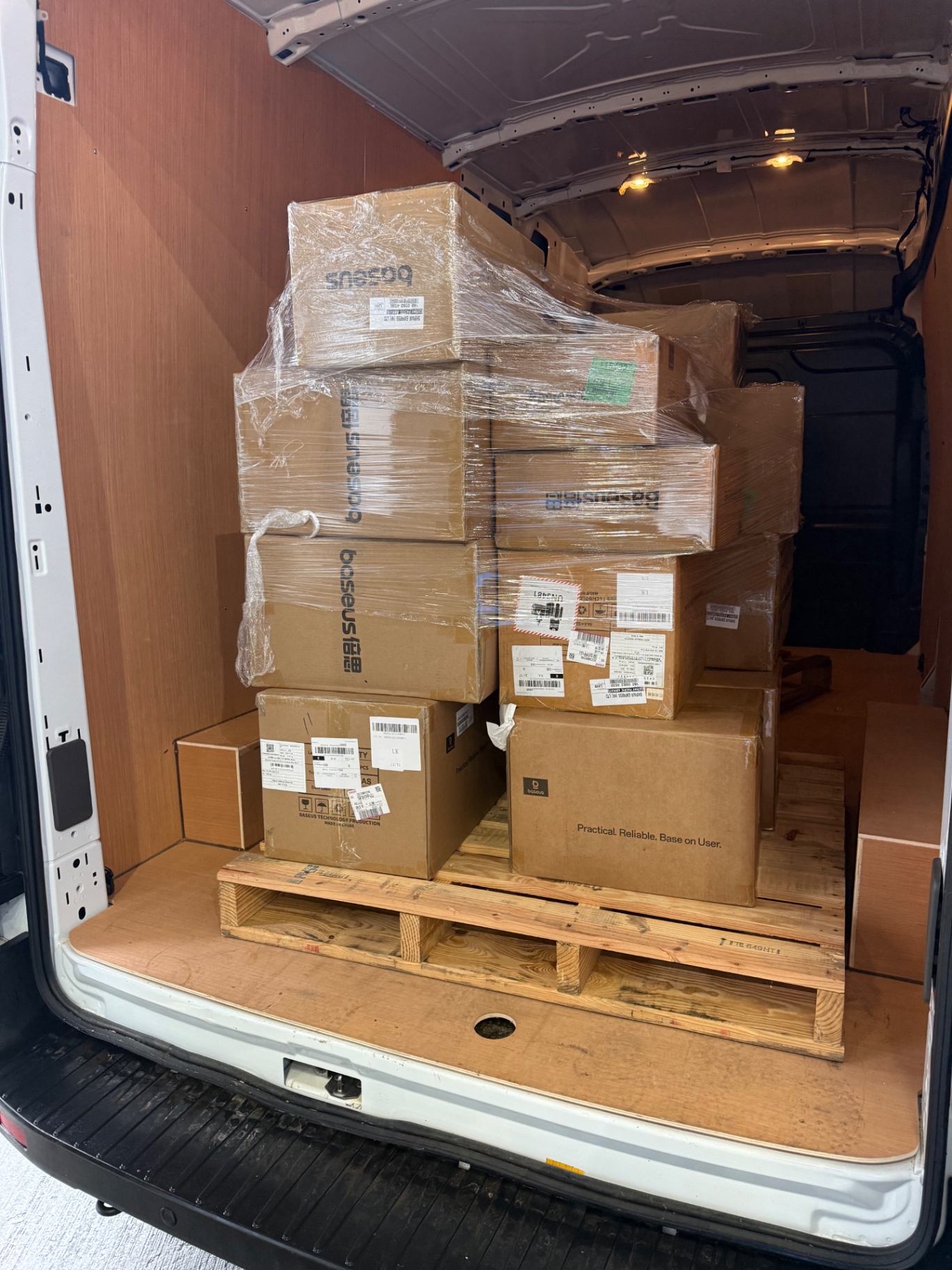 Full van load of stacked wrapped boxes